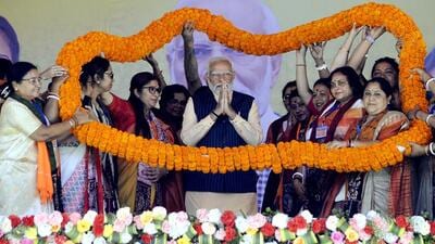 Prime Minister Narendra Modi being garlanded by BJP Mohila Morcha members during a Nari Shakti Vandan rally at Barasat in West Bengal’s North 24 Parganas district on Wednesday. (ANI) Prime Minister Narendra Modi being garlanded by BJP Mohila Morcha members during a Nari Shakti Vandan rally at Barasat in West Bengal’s North 24 Parganas district on Wednesday. (ANI)