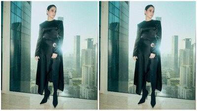 Her stylish black outfit featured a luxurious satin fabric, statement shoulders, long sleeves and a thigh slit with a crystal embroidered brooch that added a royal touch to her look, (Instagram/@tamannaahspeaks) Her stylish black outfit featured a luxurious satin fabric, statement shoulders, long sleeves and a thigh slit with a crystal embroidered brooch that added a royal touch to her look, (Instagram/@tamannaahspeaks)