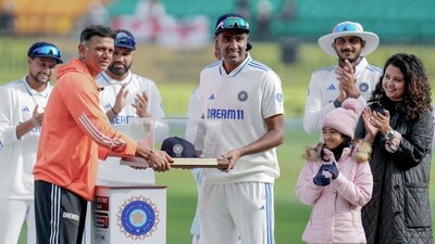 India's Ravichandran Ashwin was presented with a memento by coach Rahul Dravid on his 100th Test match before Day 1 of the 5th Test against England (BCCI-X) India's Ravichandran Ashwin was presented with a memento by coach Rahul Dravid on his 100th Test match before Day 1 of the 5th Test against England (BCCI-X)