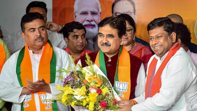 Former Calcutta High Court judge Justice Abhijit Gangopadhyay joins BJP in the presence of BJP WB President Sukanta Majumdar and Leader of Opposition in State Assembly Suvendu Adhikari, at BJP office, in Kolkata on March 7. (PTI) Former Calcutta High Court judge Justice Abhijit Gangopadhyay joins BJP in the presence of BJP WB President Sukanta Majumdar and Leader of Opposition in State Assembly Suvendu Adhikari, at BJP office, in Kolkata on March 7. (PTI)