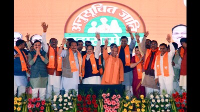 Chief minister Yogi Adityanath with BJP National President JP Nadda and others during the ‘Scheduled Caste Mahasammelan’ organised by BJP Scheduled Caste Morcha, in Agra on Thursday. (AGENCY)