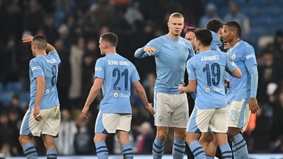 Manchester City's players celebrate on the pitch after the UEFA Champions League round of 16, second-leg. (AFP)