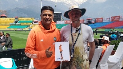 Andy Brown poses with Rahul Dravid. Andy Brown poses with Rahul Dravid.