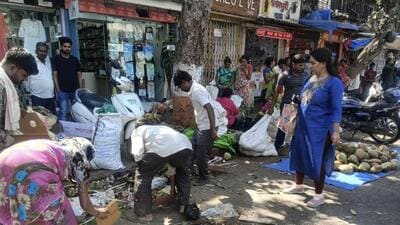 Hawkers clean up wet waste on VS Agashe Road in Dadar (Jeet Mashru)