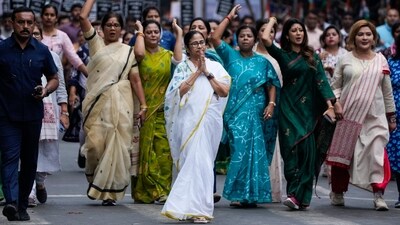 West Bengal chief minister Mamata Banerjee leads a procession on the eve of International Women's Day in Kolkata on March 7. (AP) West Bengal chief minister Mamata Banerjee leads a procession on the eve of International Women's Day in Kolkata on March 7. (AP)