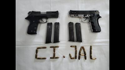 Two .32 bore pistols, four magazines, 30 live cartridges and a Splendor motorcycle (PB08 FE 3940) have been recovered from their possession. (HT File) Two .32 bore pistols, four magazines, 30 live cartridges and a Splendor motorcycle (PB08 FE 3940) have been recovered from their possession. (HT File)