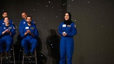 Nora AlMatrooshi, a NASA Artemis astronaut candidate graduate, smiles during a ceremony at Johnson Space Center in Houston, Texas, on March 5, 2024. (AFP)