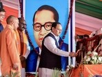 Agra, Mar 7 (ANI): Bharatiya Janata Party (BJP) National President JP Nadda lights a ceremonial lamp during the 'Scheduled Caste Mahasammelan' organised by the BJP Scheduled Caste Morcha, as Uttar Pradesh Chief Minister Yogi Adityanath and others look on, in Agra on Thursday. (ANI Photo)