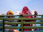 Women display their voter's identity card in Rajasthan, 2023. (AP Photo) Women display their voter's identity card in Rajasthan, 2023. (AP Photo)