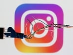 FILE PHOTO: Broken Ethernet cable is seen in front of Instagram logo in this illustration taken March 11, 2022. REUTERS/Dado Ruvic/Illustration/File Photo