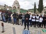 Palestinian Muslims perform the Friday Noon prayer on a street in east Jerusalem 