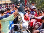 Devotees perform 'abhishek' at Shiv temple on the Mahashivratri festival at a Shiv Mandir in Gurugram.