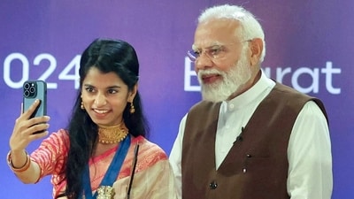 Singer Maithili Thakur clicks a selfie with PM Narendra Modi during the National Creators Award. (ANI)