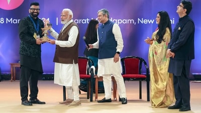PM Narendra Modi presents the Best Creator in Tech Category award to Gaurav Chaudhary during the National Creators Award. (ANI)
