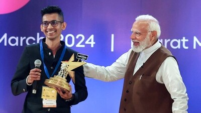 PM Narendra Modi presents the Swachhta Ambassador Award to Malhar Kalambe during the National Creators Award. (ANI)