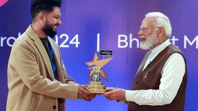 PM Narendra Modi presents the Best Creator in Education Category award to Naman Deshmukh during the first-ever National Creators Award at Bharat Mandapam in New Delhi on Friday. (ANI)