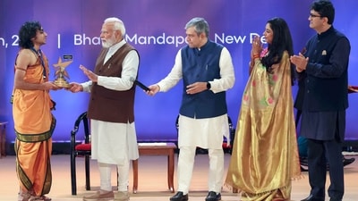 PM Narendra Modi presents the Best Micro Creator award to Aridaman during the National Creators Award. (ANI)