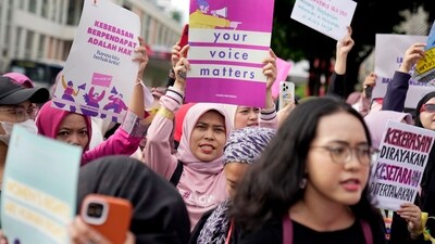 Activists display posters during an International Women's Day rally in Jakarta, Indonesia, Friday, March 8, 2024. (AP Photo/Dita Alangkara) (AP)