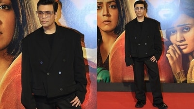 Karan Johar wore a fashionable, oversized suit in a dark shade pairing it with clear glasses. Karan Johar wore a fashionable, oversized suit in a dark shade pairing it with clear glasses.