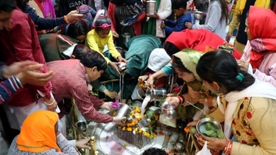 Devotees perform 'abhishek' at Aap Shambhu temple in Jammu on Maha Shivratri. (PTI)