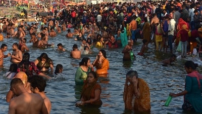 Devotees take a holy dip in River Ganga on the occasion of Maha Shivratri at Sangam, the confluence of rivers Ganges, Yamuna and mythical Saraswati, in Prayagraj. (PTI)