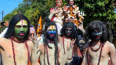 Artists dressed as Lord Shiva and Goddess Parvati take part in a procession taken out by the members of Pashupatinath Nepali Community on the Mahashivratri festival in Bhopal. (PTI)