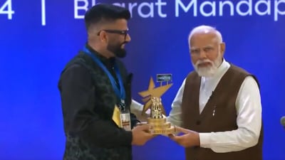 Prime Minister Narendra Modi presents the Best Creator in Tech Category award to Gaurav Chaudhary at Bharat Mandapam on Friday. (ANI) Prime Minister Narendra Modi presents the Best Creator in Tech Category award to Gaurav Chaudhary at Bharat Mandapam on Friday. (ANI)