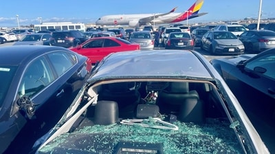Damaged cars are seen in an on-airport employee parking lot after tire debris from a Boeing 777 landed on them at San Francisco International Airport, Thursday, March 7, 2024. A United Airlines jetliner bound for Japan made a safe landing in Los Angeles on Thursday after losing a tire while taking off from San Francisco. (AP Photo/Haven Daley) (AP) Damaged cars are seen in an on-airport employee parking lot after tire debris from a Boeing 777 landed on them at San Francisco International Airport, Thursday, March 7, 2024. A United Airlines jetliner bound for Japan made a safe landing in Los Angeles on Thursday after losing a tire while taking off from San Francisco. (AP Photo/Haven Daley) (AP)
