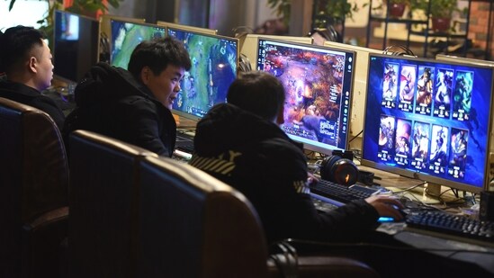 People play online games in an internet cafe in Fuyang in central China's Anhui province Friday, March 1, 2019. China's authority in charge of press and publications has approved 150 online games, saying it fully supports the industry after newly proposed curbs caused massive losses for major game companies. The National Press and Publication Administration issued a statement on its Weibo social media account Monday, Dec. 25, 2023, saying the approvals demonstrate active support for the development of online games.(Chinatopix via AP) (AP)