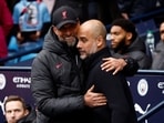 Manchester City manager Pep Guardiola with Liverpool manager Juergen Klopp before the match 