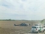 A view from inside a vehicle shows emergency services personnel responding to a helicopter crash near La Grulla, Texas, United States, March 8, 2024 in this screen grab obtained from social media video. A.C./via REUTERS