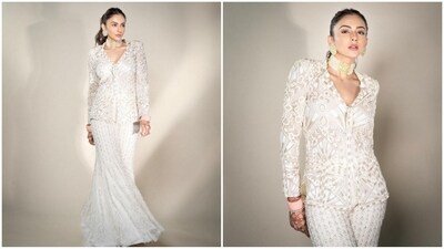 Her outfit comes in a captivating ivory shade and features a V-neck kurta with full sleeves and an intricate floral pattern all over for a glamorous touch. She paired it with a matching sharara pant, perfectly blending tradition with contemporary flair. (Instagram/@rakulpreet) Her outfit comes in a captivating ivory shade and features a V-neck kurta with full sleeves and an intricate floral pattern all over for a glamorous touch. She paired it with a matching sharara pant, perfectly blending tradition with contemporary flair. (Instagram/@rakulpreet)