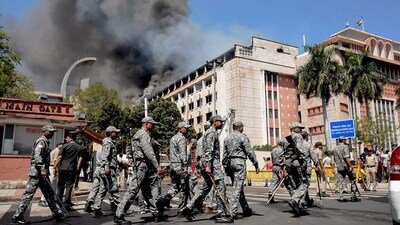 Security personnel approach to Madhya Pradesh Secretariat where a fire broke out in Bhopal on March 9, 2024. (PTI) Security personnel approach to Madhya Pradesh Secretariat where a fire broke out in Bhopal on March 9, 2024. (PTI)