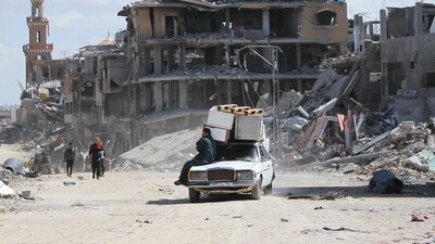 Palestinians leave with their belongings on a vehicle following the Israeli offensive in Khan Younis, southern Gaza, on Friday, March 8, 2024. (Bloomberg) Palestinians leave with their belongings on a vehicle following the Israeli offensive in Khan Younis, southern Gaza, on Friday, March 8, 2024. (Bloomberg)