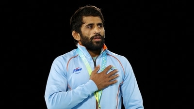 India's Bajrang Punia celebrates on the podium during the medal ceremony (REUTERS)
