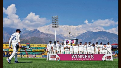 Indian cricket team captain Rohit Sharma (L) with the trophy joins his teammates after the Test in Dharamsala on Saturday. (PTI) Indian cricket team captain Rohit Sharma (L) with the trophy joins his teammates after the Test in Dharamsala on Saturday. (PTI)