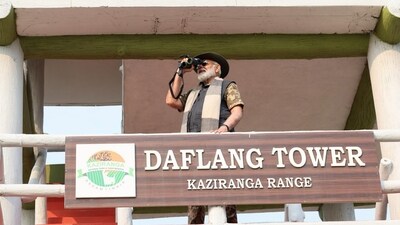 Using binoculars, Prime Minister Narendra Modi took in the landscapes during his visit to Assam's Kaziranga National Park on Saturday. (X/@narendramodi) Using binoculars, Prime Minister Narendra Modi took in the landscapes during his visit to Assam's Kaziranga National Park on Saturday. (X/@narendramodi)