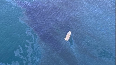 This handout photo released on March 8, 2024 by the United States Coast Guard (USCG) shows an aerial view of a Unified Command with representatives from the US Coast Guard, California Department of Fish and Wildlife's Office of Spill Prevention and Response (CDFW-OSPR), and Orange County Sheriff's Department responding to an oil sheen observed off the shore of Huntington Beach, California. The US Coast Guard is investigating a two-mile wide oil spill just off the California coast near Los Angeles, officials said on March 8. (AFP) This handout photo released on March 8, 2024 by the United States Coast Guard (USCG) shows an aerial view of a Unified Command with representatives from the US Coast Guard, California Department of Fish and Wildlife's Office of Spill Prevention and Response (CDFW-OSPR), and Orange County Sheriff's Department responding to an oil sheen observed off the shore of Huntington Beach, California. The US Coast Guard is investigating a two-mile wide oil spill just off the California coast near Los Angeles, officials said on March 8. (AFP)