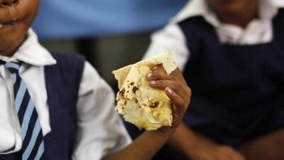 A schoolgirl eats her free mid-day meal, distributed by a government-run primary school in New Delhi. (Reuters Photo) A schoolgirl eats her free mid-day meal, distributed by a government-run primary school in New Delhi. (Reuters Photo)