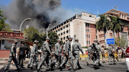 Security personnel approach to Madhya Pradesh Secretariat where a fire broke out in Bhopal on March 9, 2024. (PTI)