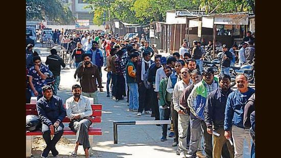 People queueing up outside the court to fill e-challans in the Lok Adalat in Panchkula on Saturday. (HT PHOTO)