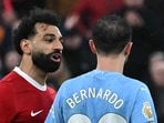 Liverpool's Egyptian striker #11 Mohamed Salah (L) remonstrates with Manchester City's Portuguese midfielder #20 Bernardo Silva