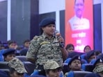 A Chhattisgarh Police personnel speaks during her interaction with chief minister Vishnu Deo Sai at an event to mark International Women's Day.