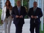 Former first lady Melania Trump can be seen walking along with husband Donald Trump and Hungarian Prime Minister Viktor Orbán. Former first lady Melania Trump can be seen walking along with husband Donald Trump and Hungarian Prime Minister Viktor Orbán.