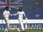 New Zealand's Rachin Ravindra, right, gestures to teammate Daryl Mitchell. New Zealand's Rachin Ravindra, right, gestures to teammate Daryl Mitchell.