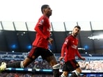 Manchester United's Marcus Rashford celebrates a goal with Bruno Fernandes.