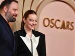 Emma Stone (R) and Greek director Yorgos Lanthimos attend the Oscar Nominees Luncheon at the Beverly Hilton in Beverly Hills, California, on February 12, 2024. 