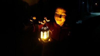 A child holds a lantern as displaced Palestinians prepare their tents for Ramadan, amid the ongoing conflict between Israel and the Palestinian Islamist group Hamas, in Rafah, in the southern Gaza Strip. (REUTERS)
