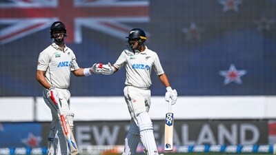 New Zealand's Rachin Ravindra, right, gestures to teammate Daryl Mitchell. (AP) New Zealand's Rachin Ravindra, right, gestures to teammate Daryl Mitchell. (AP)