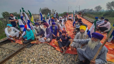 Farmers block railway tracks during their 'rail roko' protest, at Devi Das Pura, on the outskirts of Amritsar. (PTI) Farmers block railway tracks during their 'rail roko' protest, at Devi Das Pura, on the outskirts of Amritsar. (PTI)